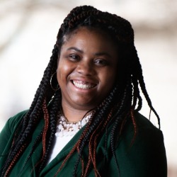 621f86c1e85af_Monique-Headshot.jpg